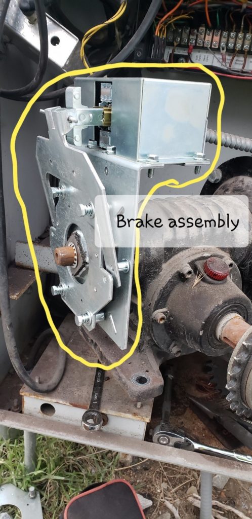 A gate operator box open with the brake assembly specifically outlined